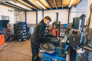 Mr Tyre Derby mechanic setting up tyre with alloy