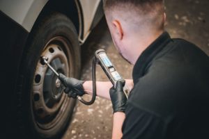 Mr Tyre Nottingham (Carlton Rd) mechanic checking tyre pressure.