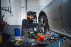 Tyre wheel knuts being removed using drill at Mr Tyre Bloxwich